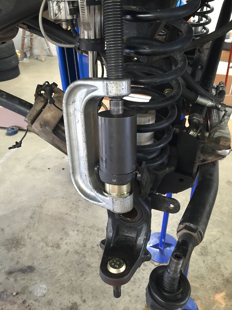 Note: I found it much easier to use a 1/2" swivel extension with my impact  as the top of the installation screw rests ever so close to the spring.